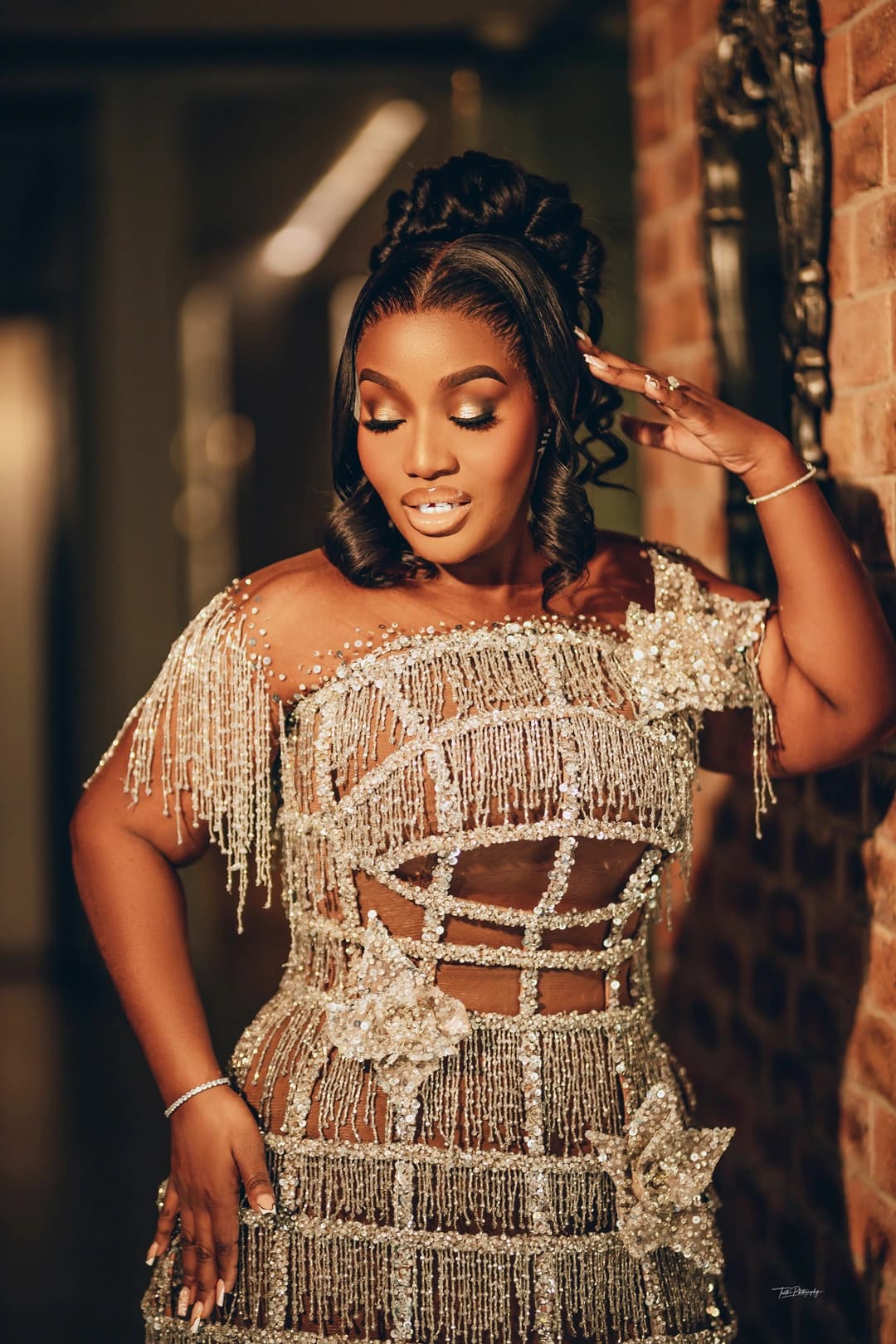 Confident woman in beige blazer working